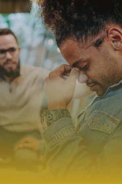 Employee experiencing workplace stress while receiving support in a trauma-informed environment.
